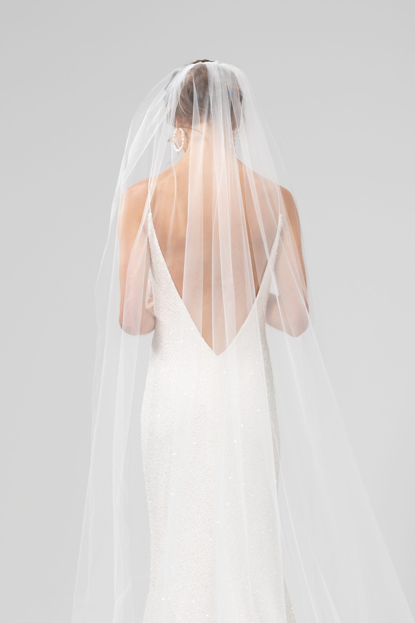 Back view of model wearing rio, a single layer veil 2.2.m veil.