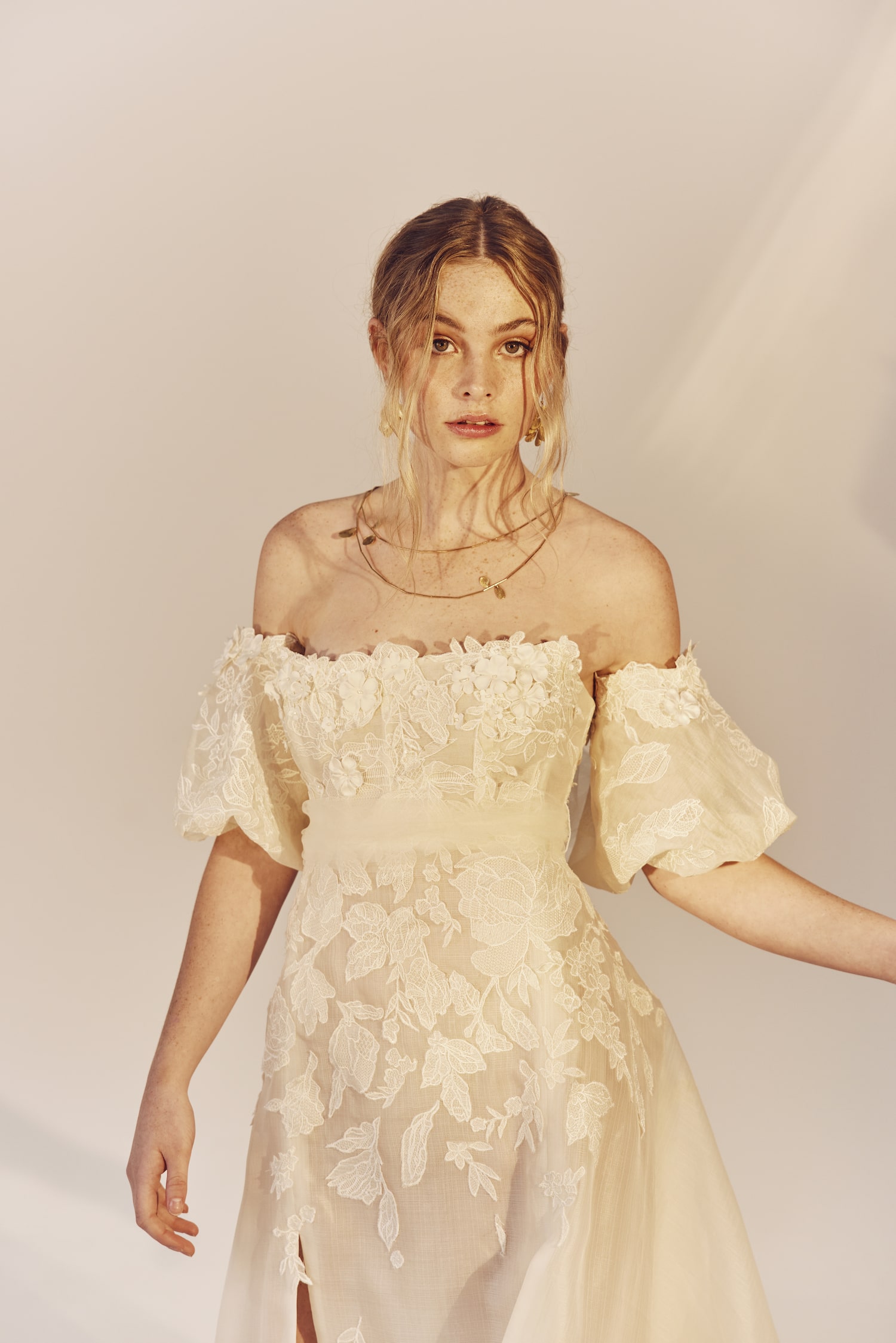 Agnes - a strapless gown with puff sleeves and embroidered organza motifs