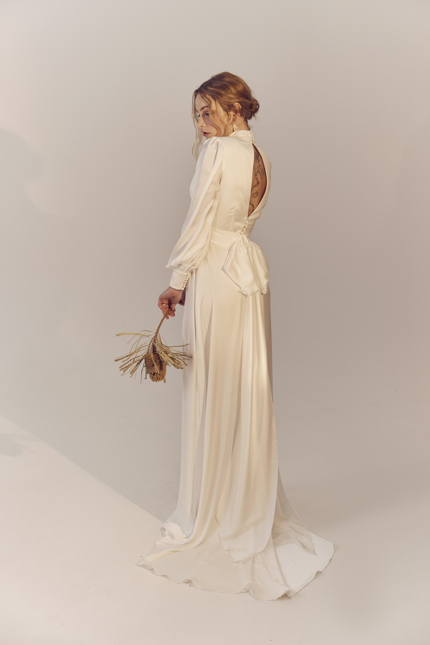 Grace full length back view - a high neck recycled polyester gown