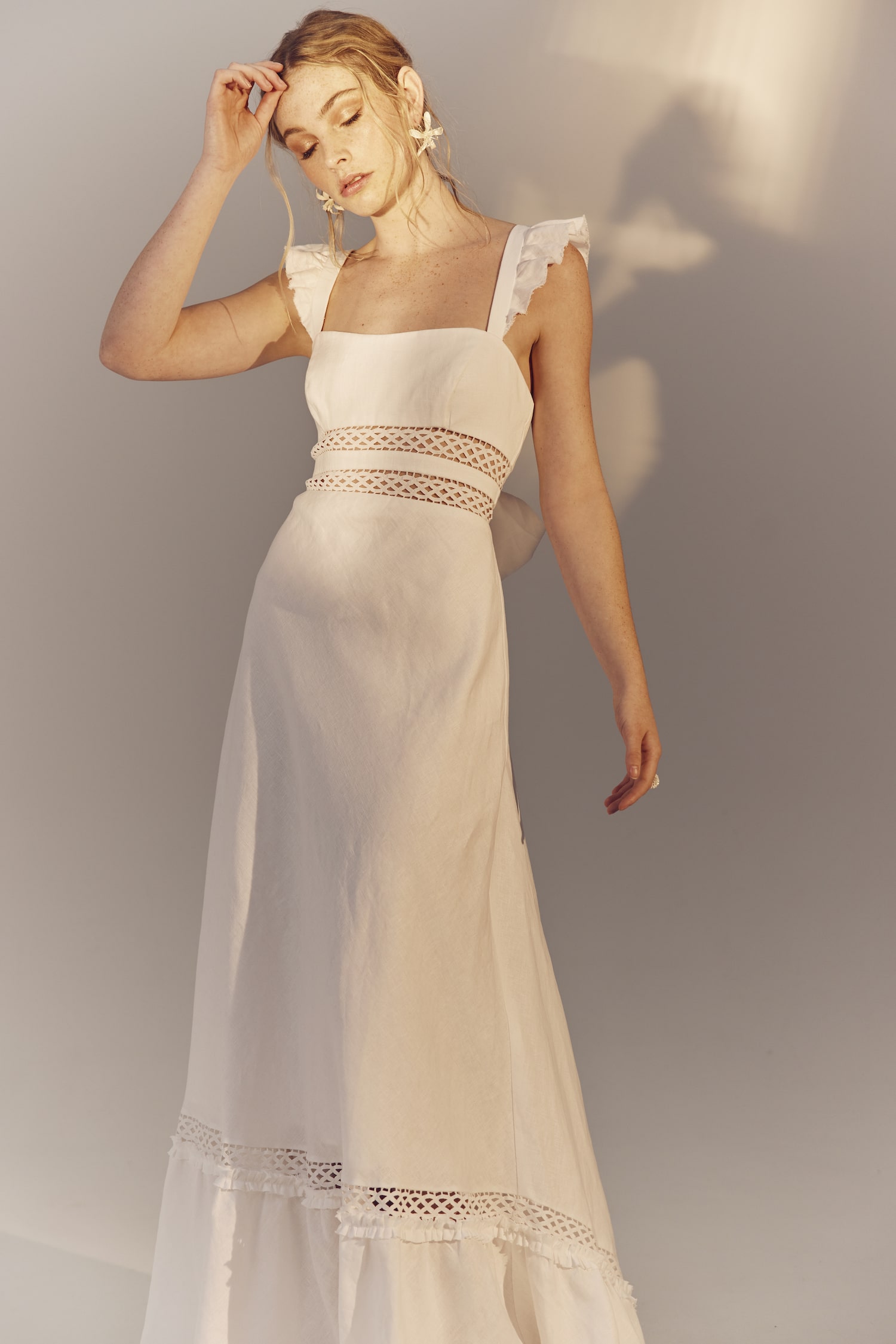 Maggie - a square neckline white linen gown with frilly cap sleeves