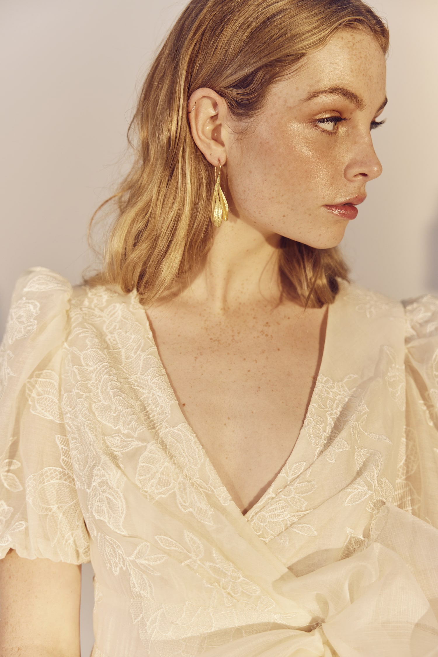 Rosa close up - an embroidered silk/cotton and pineapple organza gown with a large raw bow