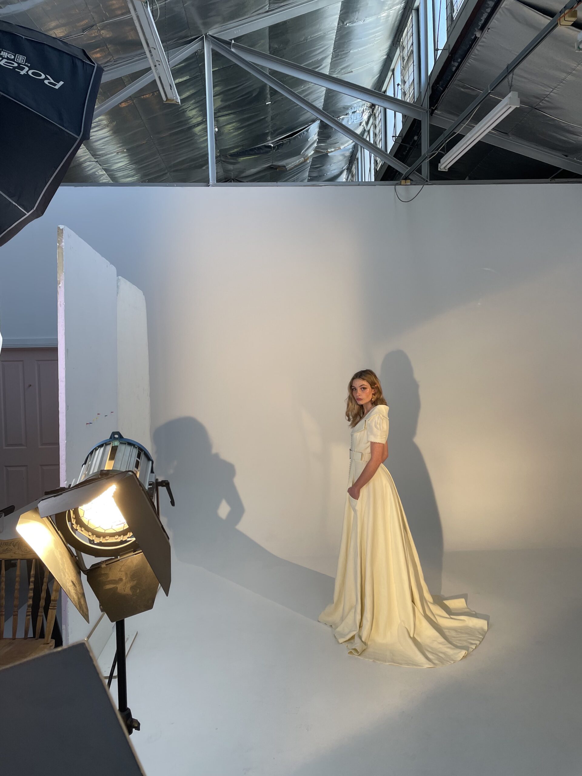 Model Jess being photographed in the studio wearing the Valerie gown