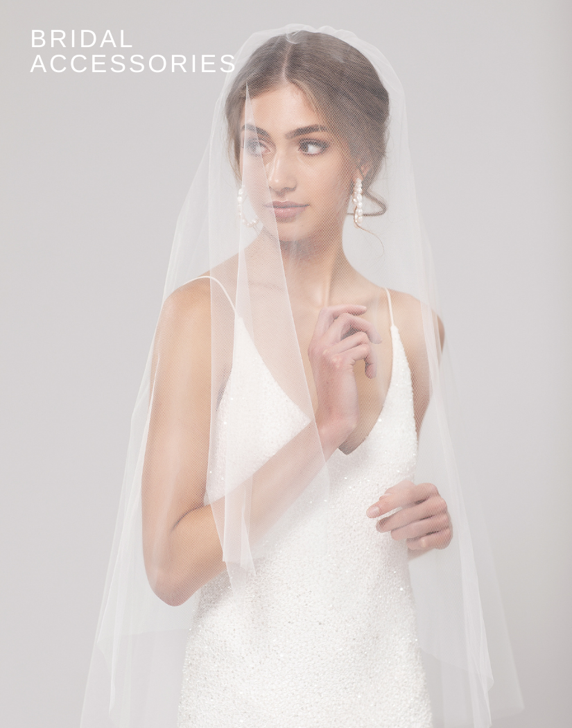 Image of model wearing blusher veil and Loulou slip gown
