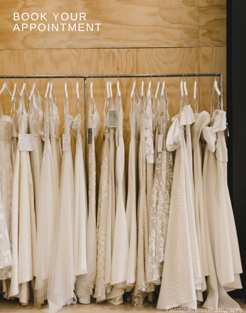 Image of rack of gowns in Calèche boutique