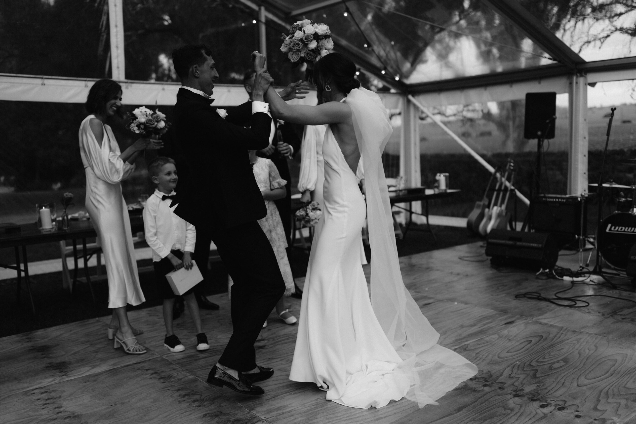 Olivia and Patrick dancing on the reception dancefloor at night