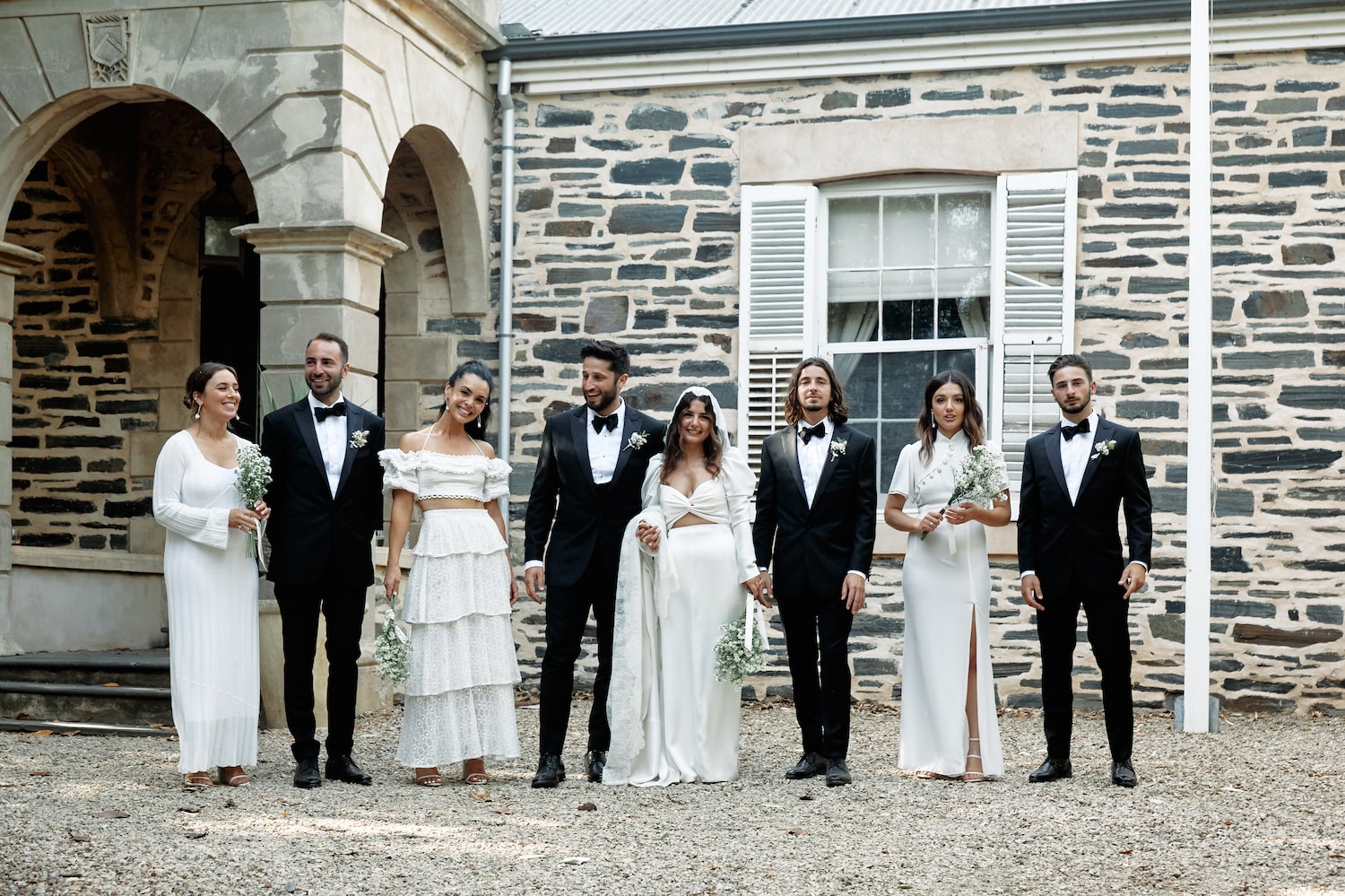 Bridal party outside the brick building at Waverly Estate