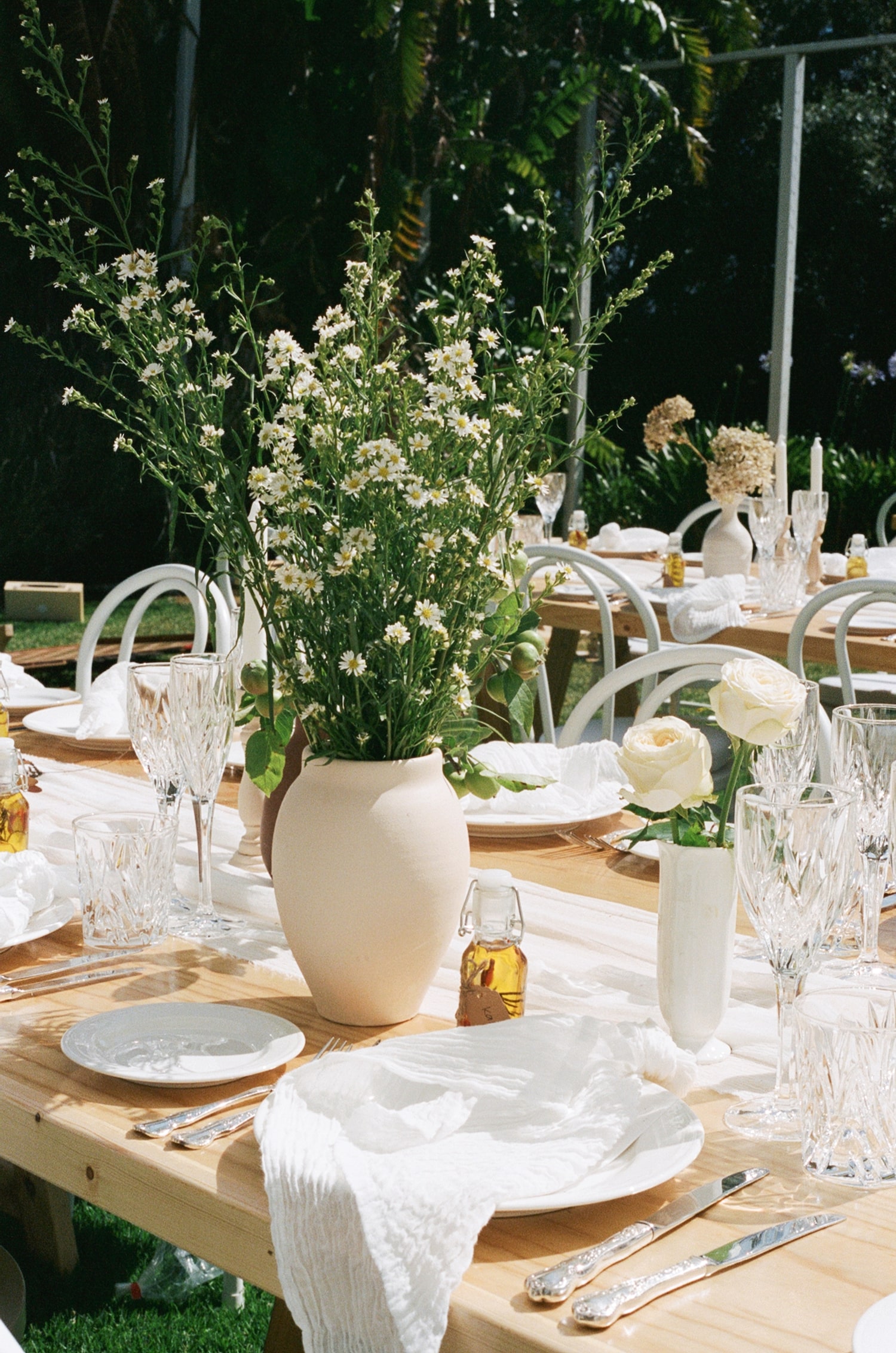 Table setting - soft neutral tones and handpicked/organic style florals
