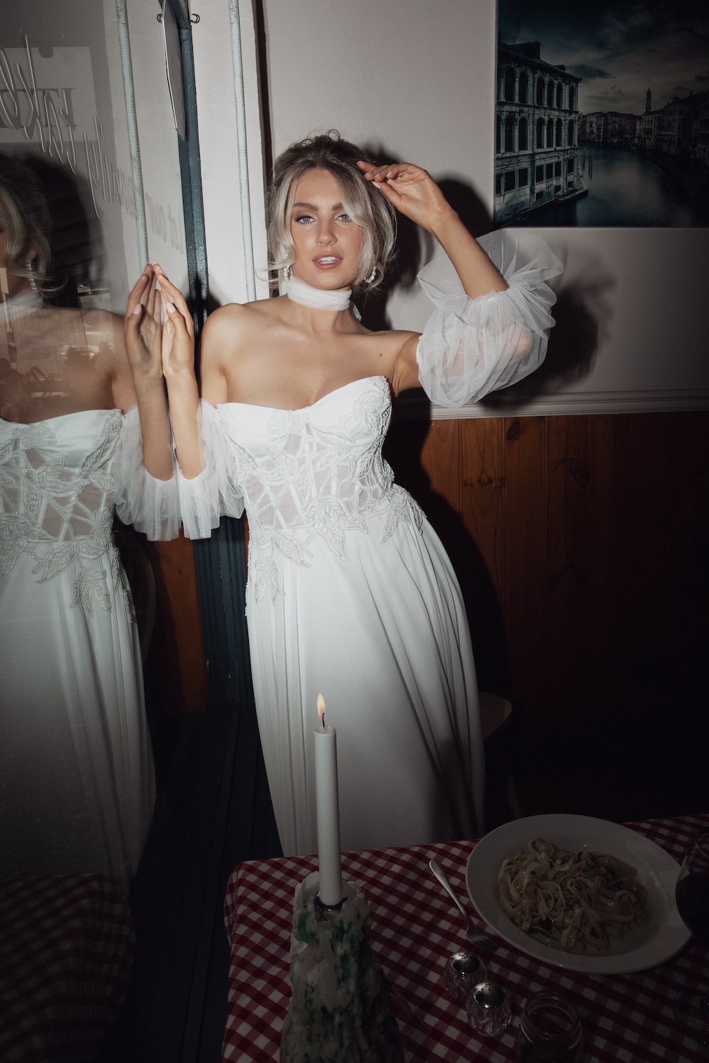 model posing by window in Italian cafe wearing the Giulietta gown.