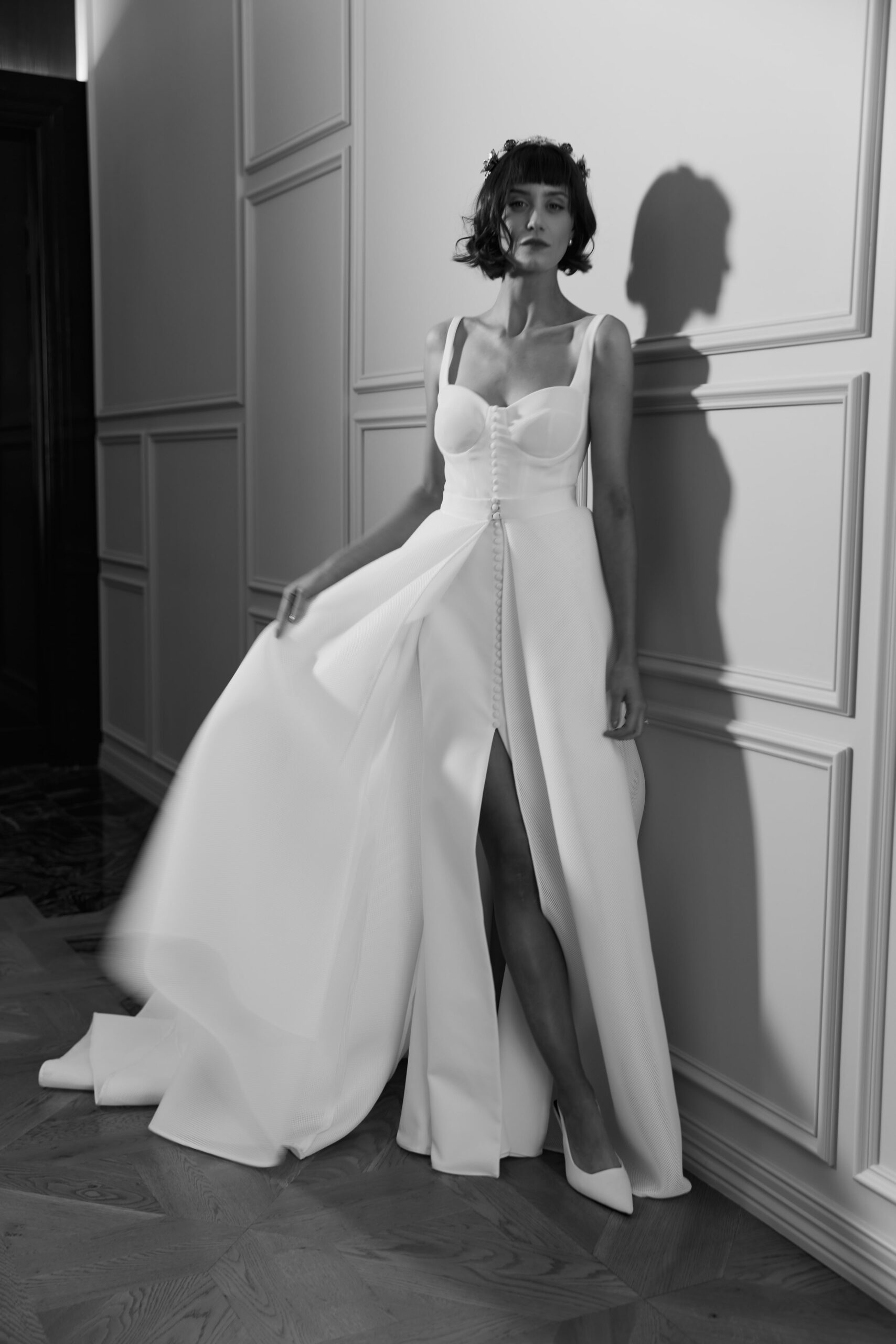 Verana dress and Romana overskirt - a stretch crepe gown with a cup bodice and front button detail worn with a full scuba mesh overskirt.