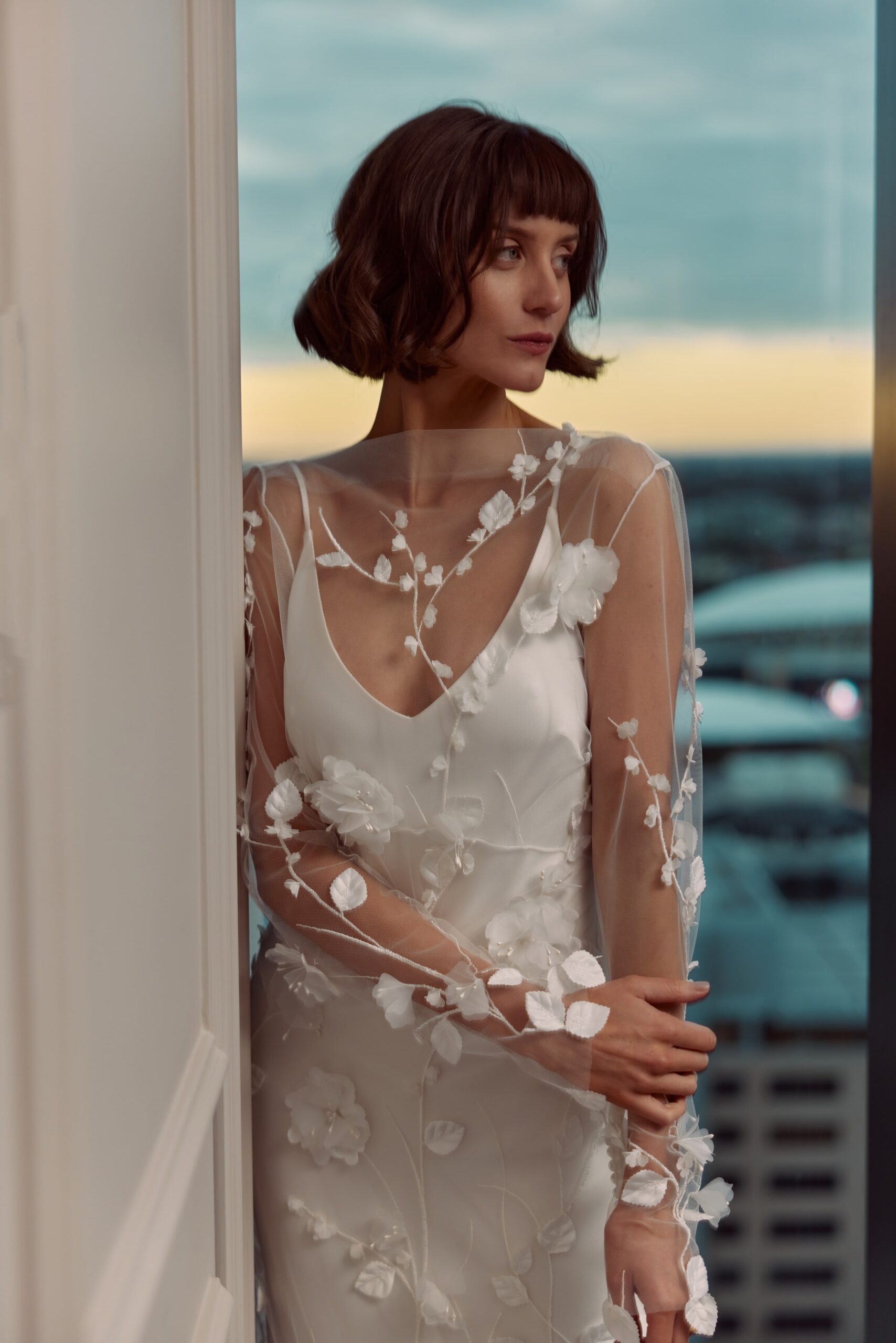 Manon overlay and Loulou slip - a sheer overlay featuring 3D floral lace worn over a V-neck satin slip gown.