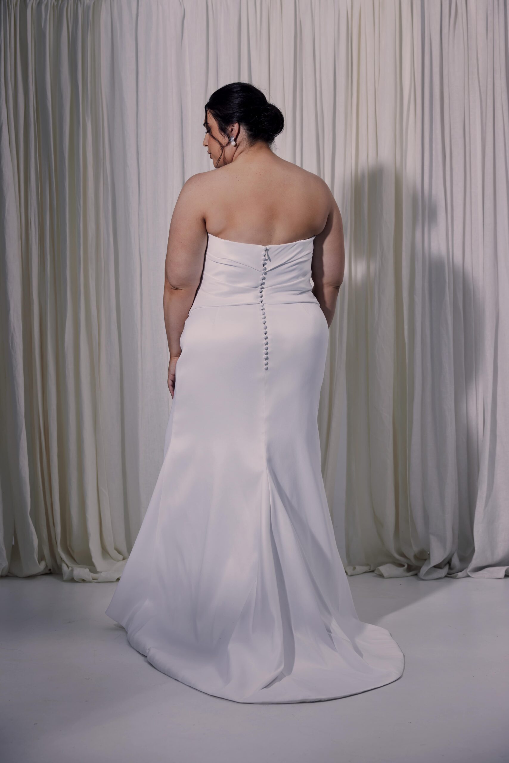 The Caroline gown - a fitted gown with draping, scoop neckline and a side split.