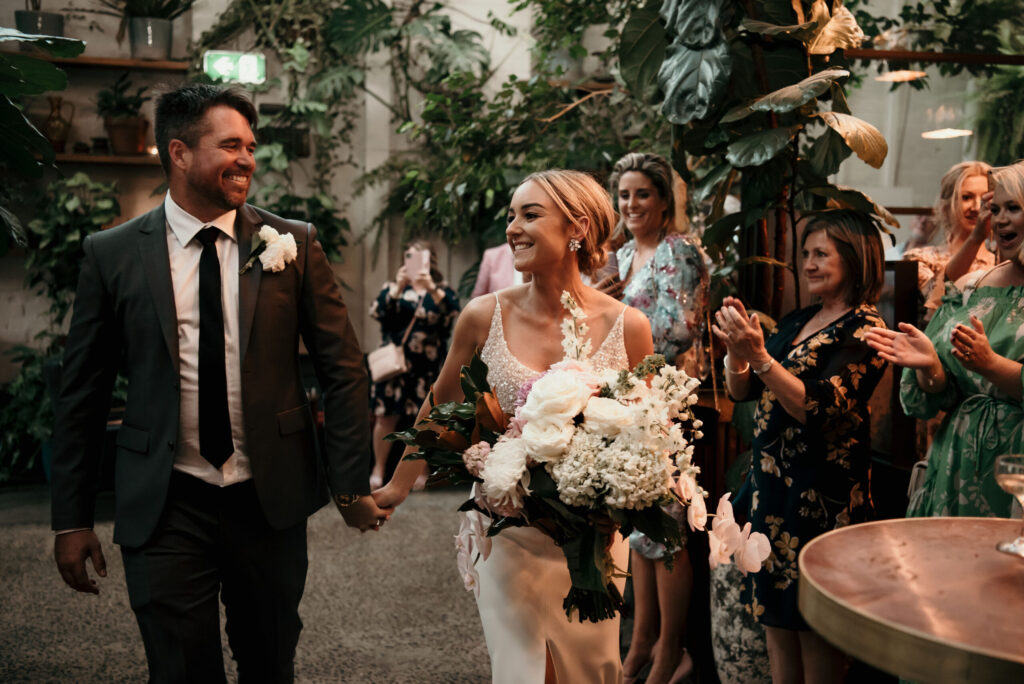 Siobhan & Lee walking into reception