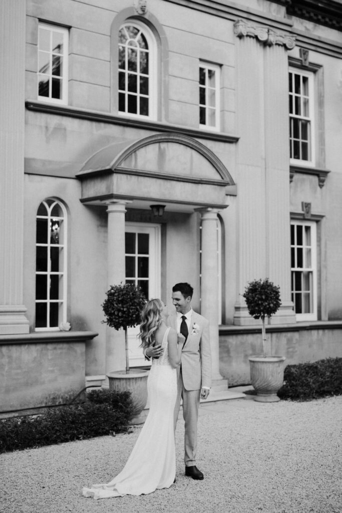 Kayla & Jonathan in front of house