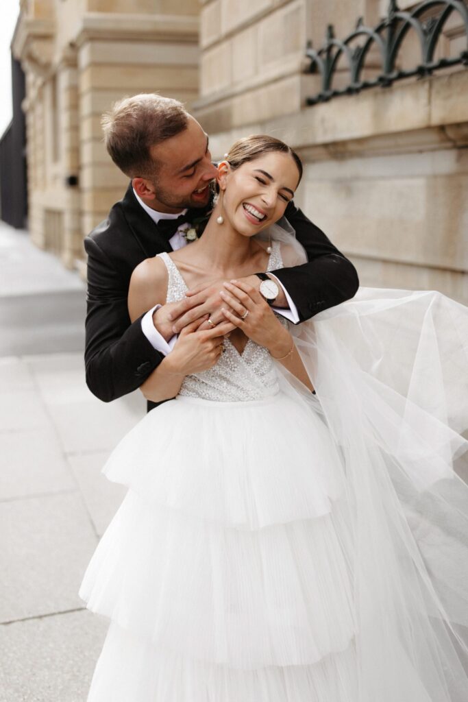 A shot of Daniel with his arms around Bethany.