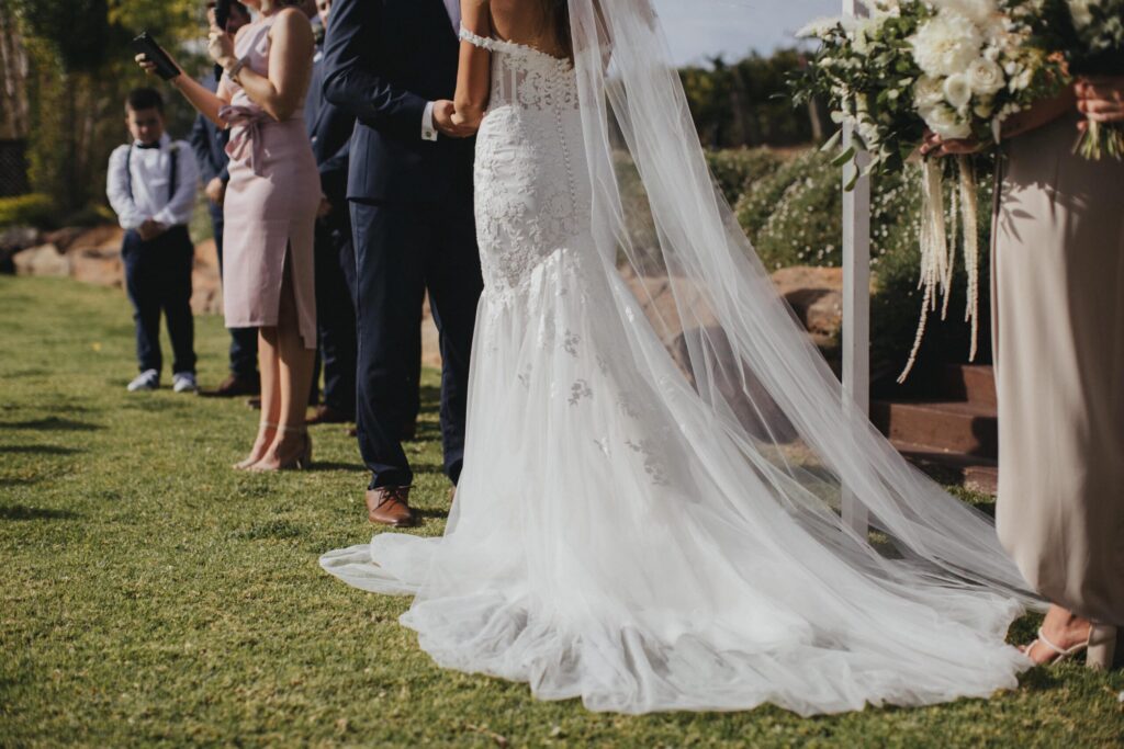 Back view of bride standing at altar